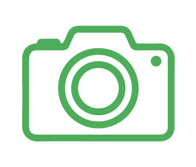 Green outline of a camera icon on a transparent background, perfect for capturing memories at your dog daycare.